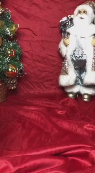 Two white snowman figurines, one ribbed and one smooth, each with a small black top hat. Minimalist Christmas decor displayed on a countertop in small and large sizes.