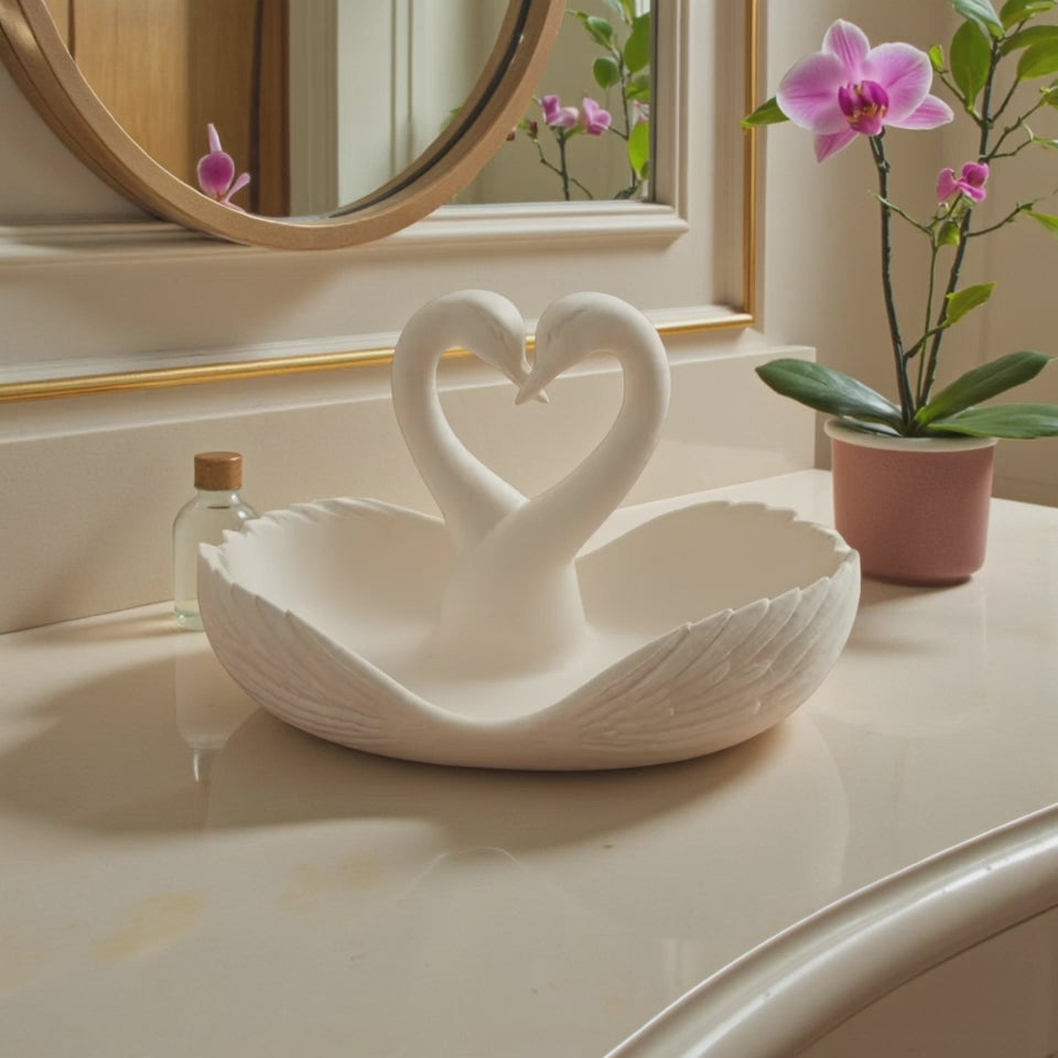 Elegant swan trinket tray holding keys and sunglasses on a wooden table
 Decorative swan jewelry dish used as an entryway catchall tray
 Sculptural swan bowl with matte finish for vanity or bedside decor
 Modern swan tray for holding rings, jewelry, and everyday essentials
Minimalist swan decor tray styled in a calm, neutral interior