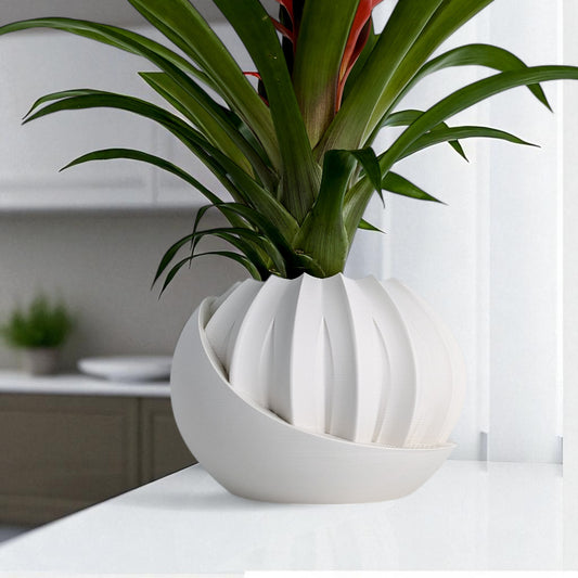 a modern 3D-printed plant pot with a hidden storage box, perfect for keeping small items discreetly tucked away. This unique design combines functionality with style, making it a standout piece for your home decor.