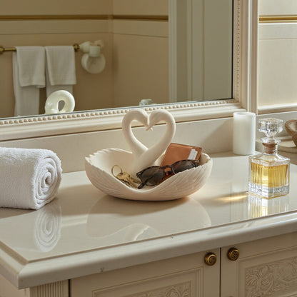 Elegant swan trinket tray holding keys and sunglasses on a wooden table
 Decorative swan jewelry dish used as an entryway catchall tray
 Sculptural swan bowl with matte finish for vanity or bedside decor
 Modern swan tray for holding rings, jewelry, and everyday essentials
Minimalist swan decor tray styled in a calm, neutral interior