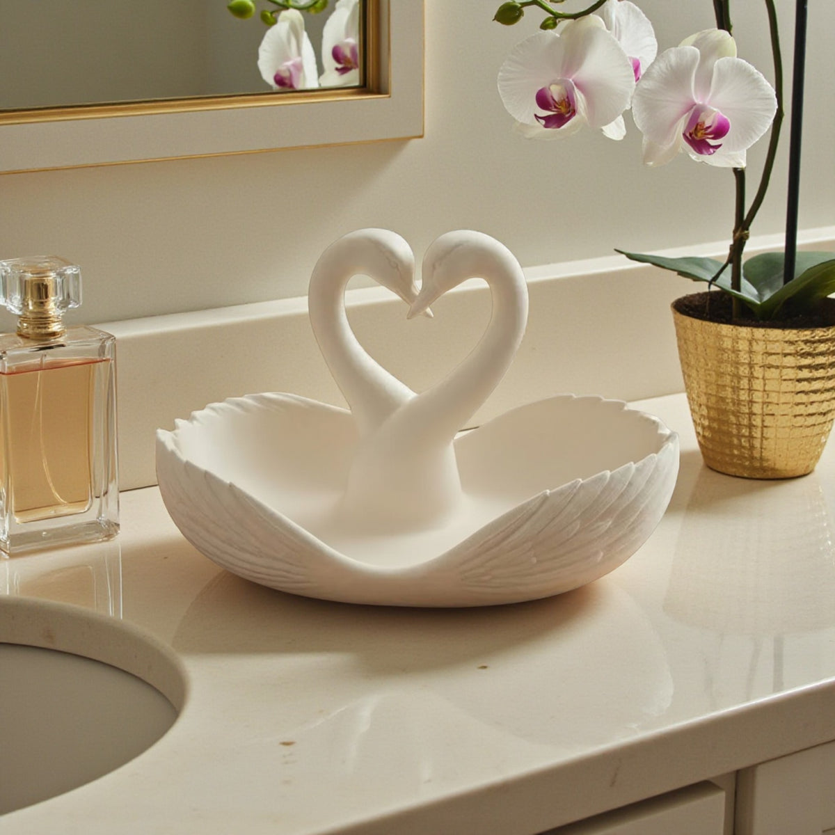 elegant swan trinket tray holding keys and sunglasses on a wooden table
 decorative swan jewelry dish used as an entryway catchall tray
 sculptural swan bowl with matte finish for vanity or bedside decor
 modern swan tray for holding rings, jewelry, and everyday essentials
minimalist swan decor tray styled in a calm, neutral interior