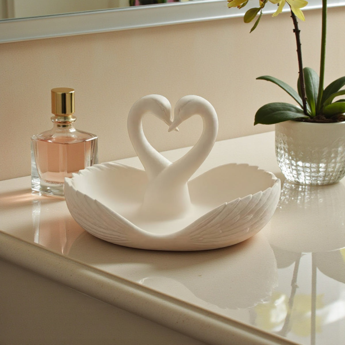 elegant swan trinket tray holding keys and sunglasses on a wooden table
 decorative swan jewelry dish used as an entryway catchall tray
 sculptural swan bowl with matte finish for vanity or bedside decor
 modern swan tray for holding rings, jewelry, and everyday essentials
minimalist swan decor tray styled in a calm, neutral interior