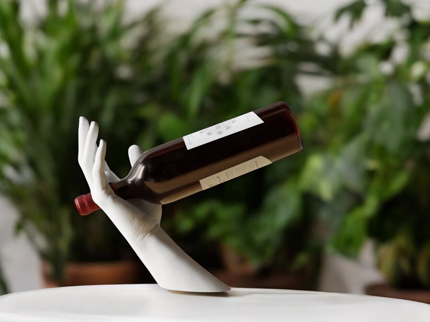 elegant hand-shaped wine holder with a unique arm design, perfect for stylishly displaying a wine bottle on countertops, dining tables, or home bars.