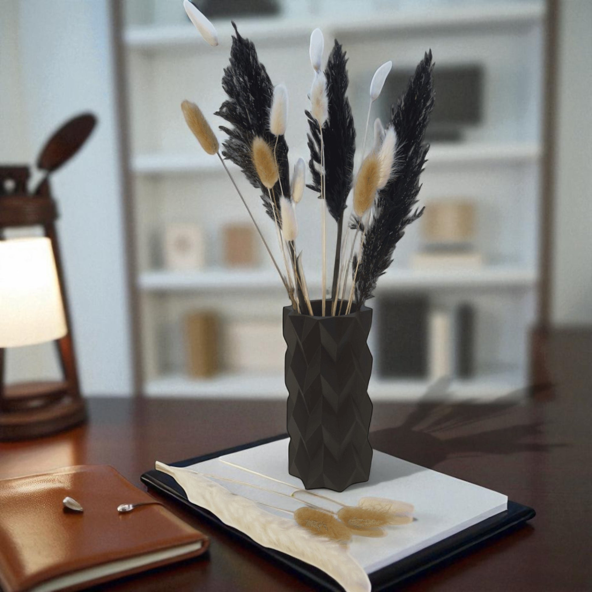 A modern 3D-printed vase with a sleek, sculptural design. Made from durable, waterproof material, this stylish vase is perfect for fresh flowers, dried arrangements, or as a standalone decor piece. Ideal for contemporary and minimalist interiors.